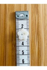 Üstten dikmeli krem bebe düğmesi. 13mm. Yıldız Papatya.