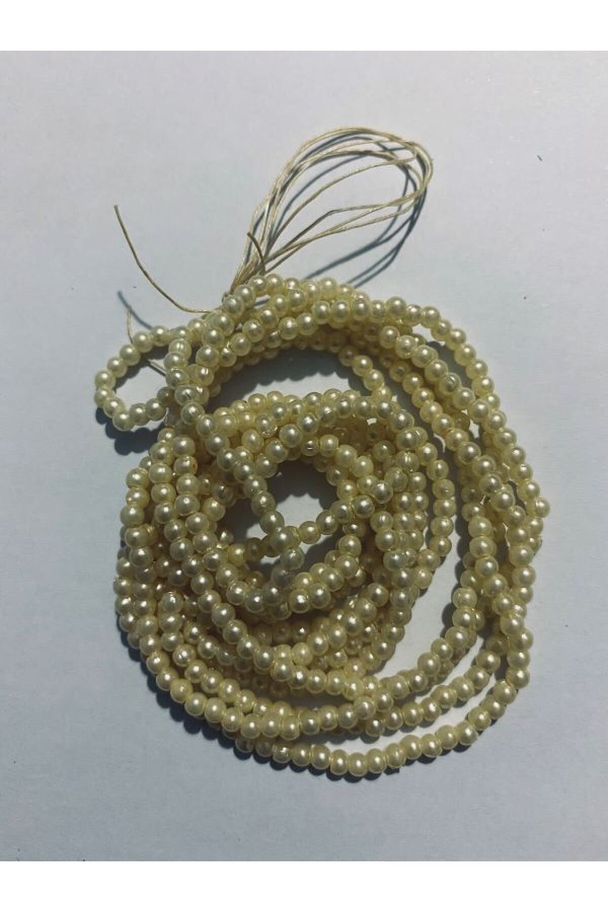 3mm Inci Boncuk 2'li Dizi. Renk: Krem. Takriben 620-640 Adet.